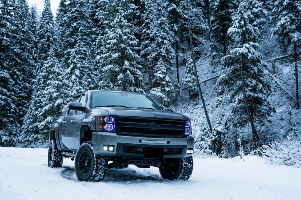 Car in snow by Drew Lindsley